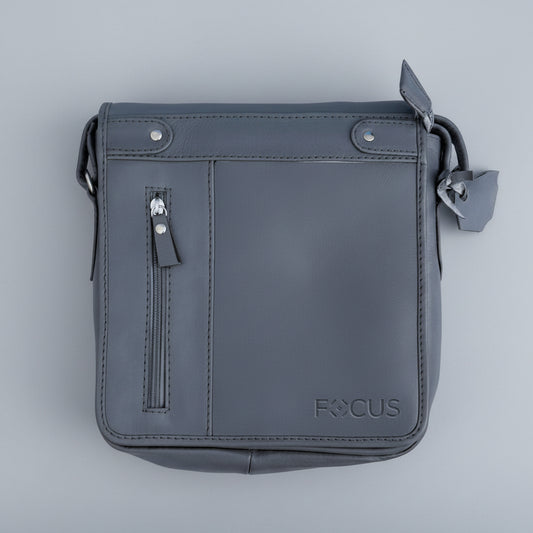 Gray leather crossbody bag with 'FOCUS' branding on a light blue background