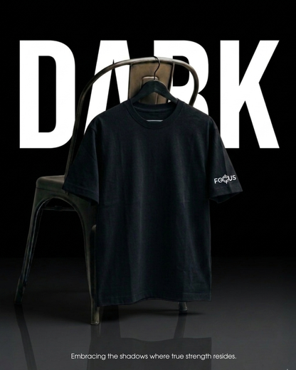 Black t-shirt with 'FOCUS' logo on a hanger against a black background with 'DARK' text.