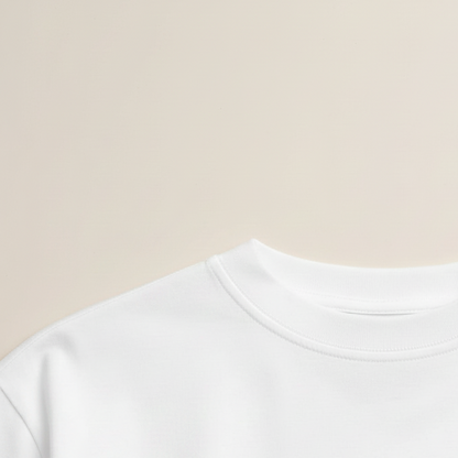 White t-shirt on a hanger against a brown background