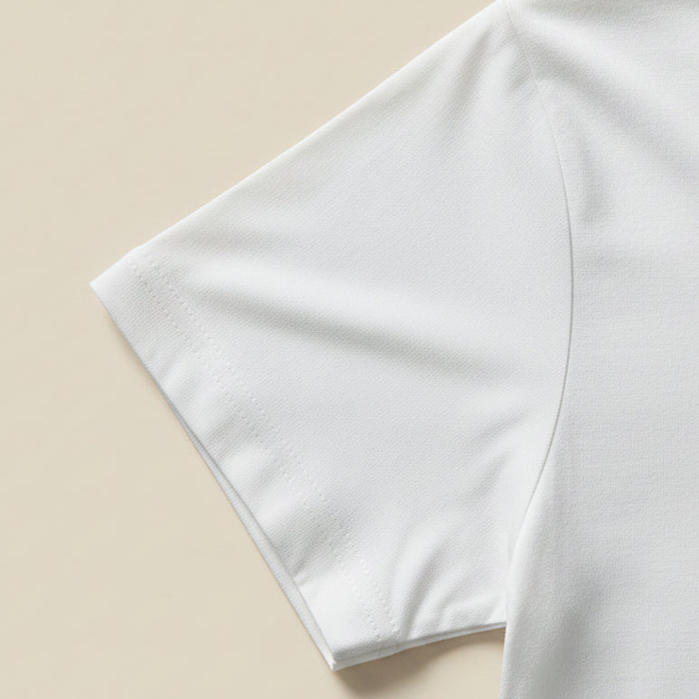 Close-up of a light-colored fabric edge on a brown background