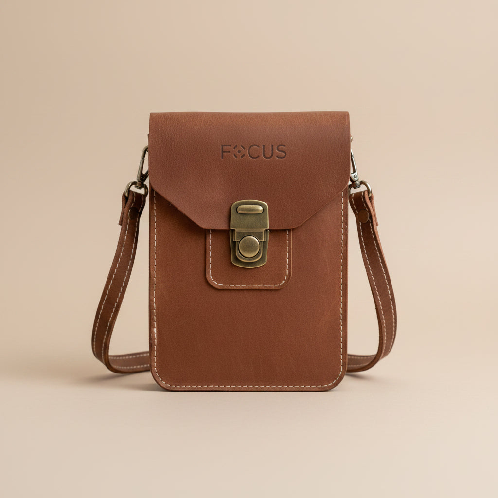 Brown leather pouch with 'FOCUS' branding on a whitebackground