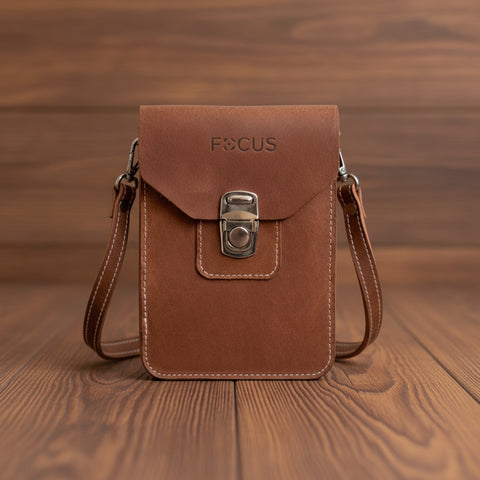 Brown leather pouch with 'FOCUS' branding on a whitebackground