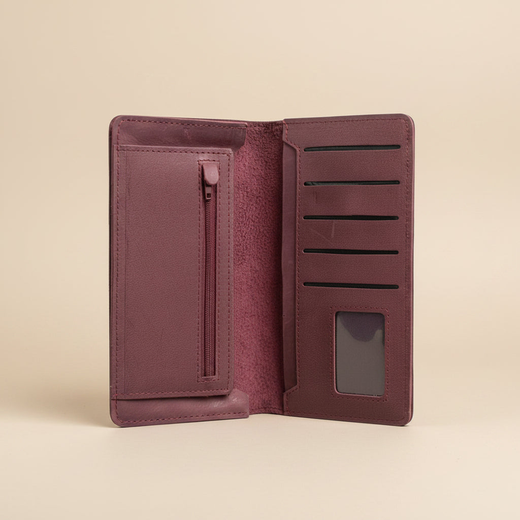 Open maroon wallet with card slots and a zipper pocket on a white background