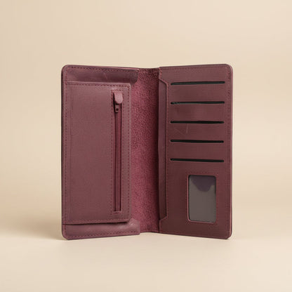 Open maroon wallet with card slots and a zipper pocket on a white background