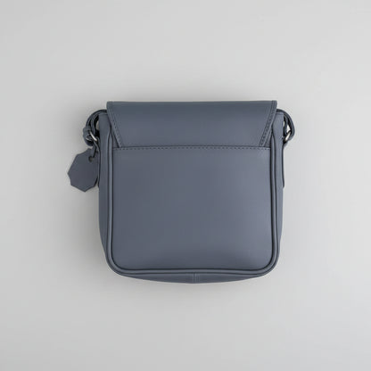 Gray leather crossbody bag on a white background