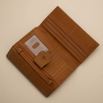 Brown wallet with a floppy disc design on a light gray background