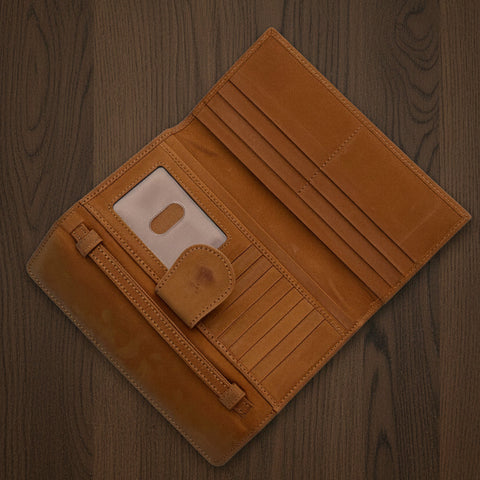 Brown wallet with a floppy disc design on a light gray background