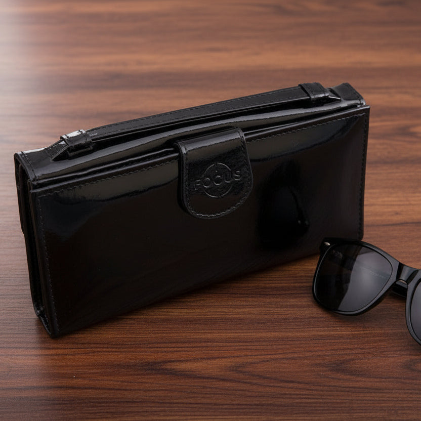 Black wallet with a brand logo on a gray background