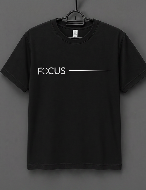Black t-shirt with 'FOCUS' text on a hanger against a gray background