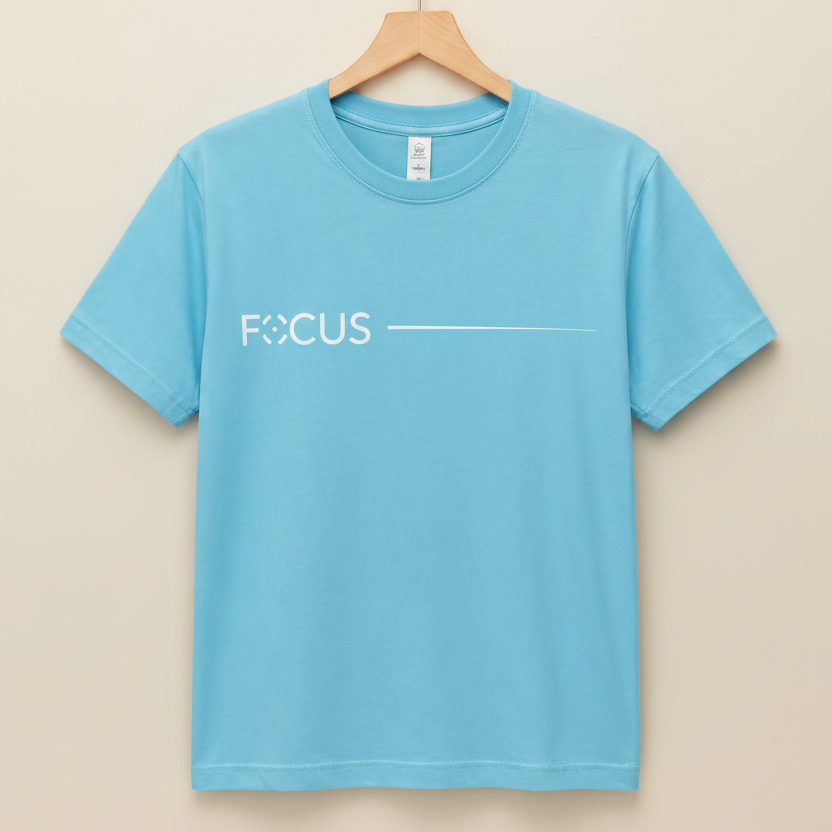 Blue t-shirt with 'FOCUS' text on a hanger against a gray background